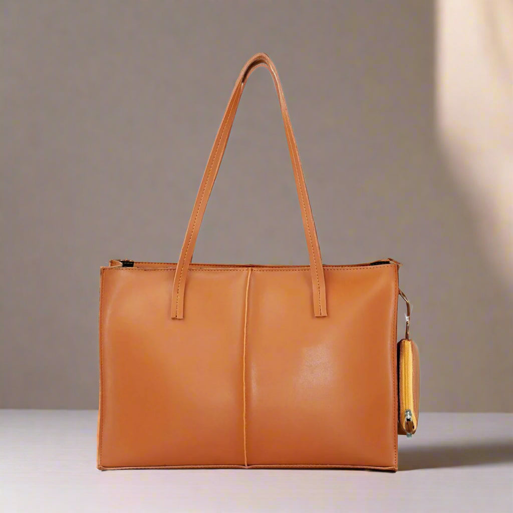 Brown leather tote bag with a matching wallet on a light gray background